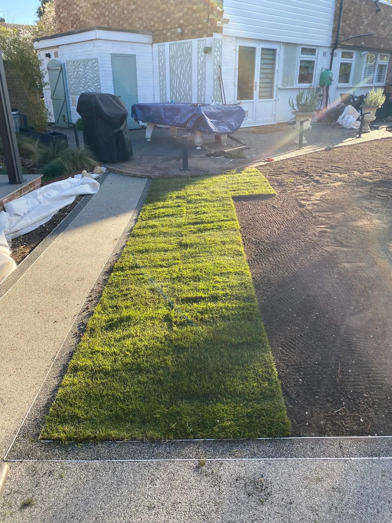 Fresh turf being laid